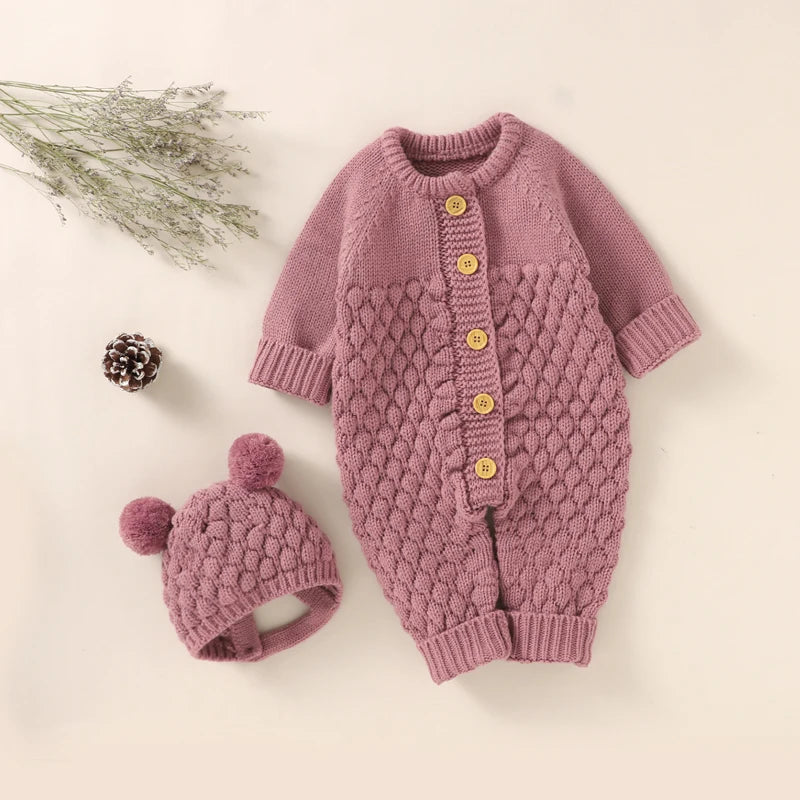 Baby Bubble knitted romper and cap set in cozy autumn/winter style, featuring soft yarn in warm tones for infants.