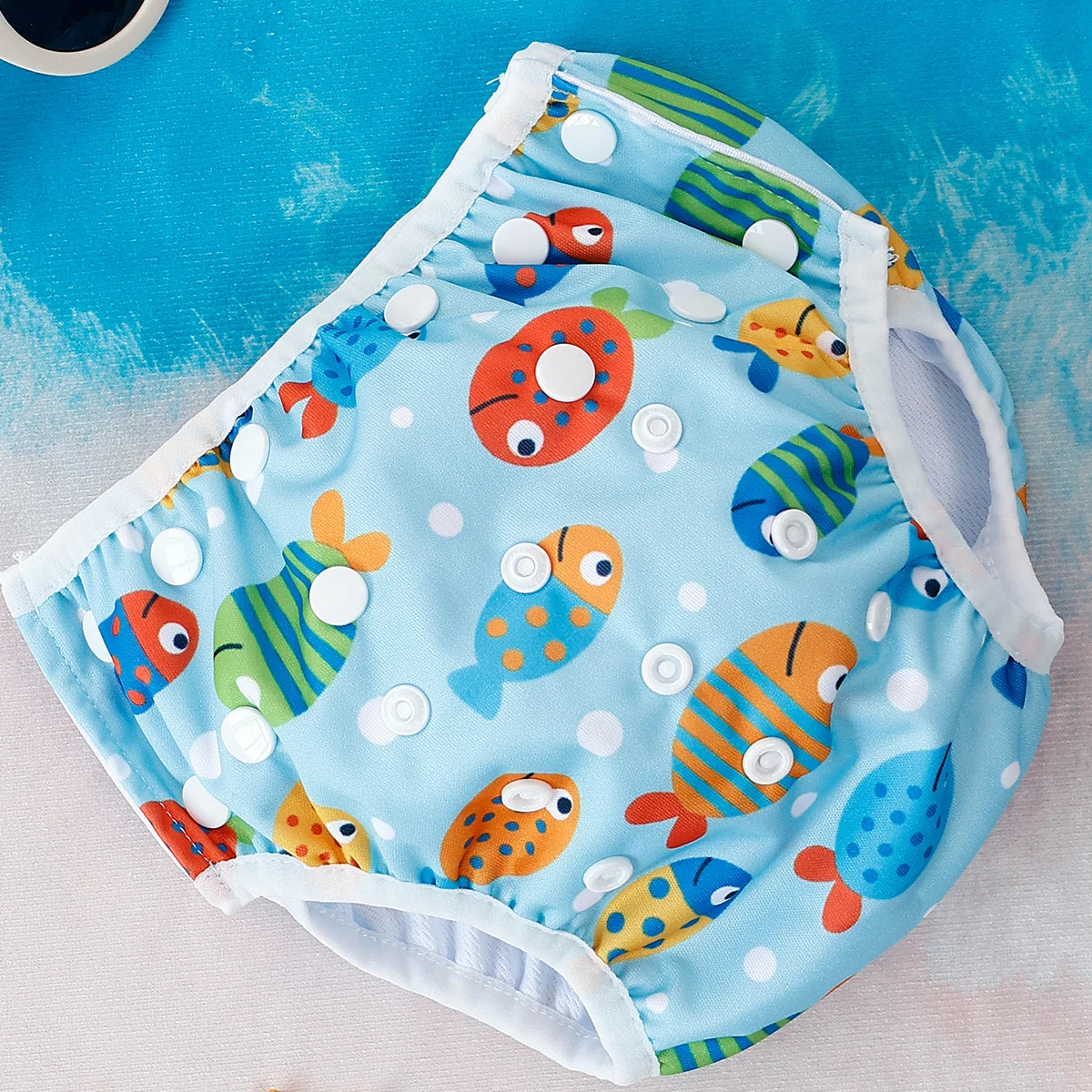 Reusable baby swim diapers with colorful animal print design from Baby Bubble, suitable for water activities and pool safety.