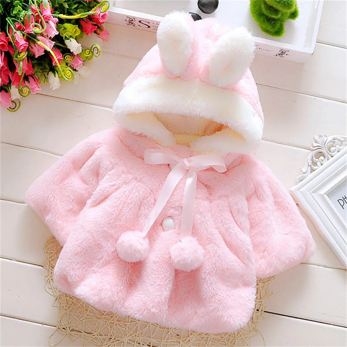 Girls wool cape by Baby Bubble, showcasing a cozy winter wool cape with stylish design and warm fabric for girls.