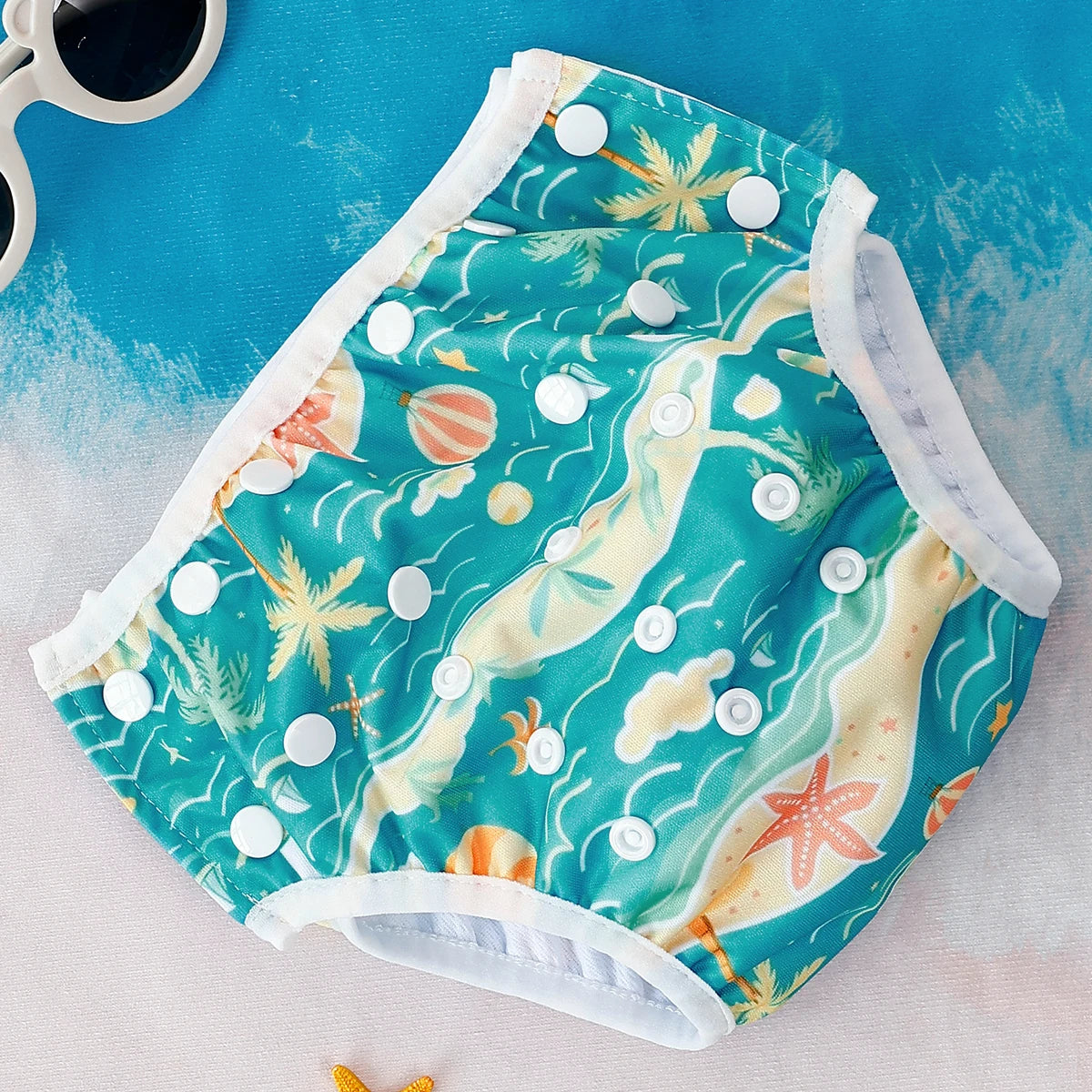 Reusable baby swim diapers with colorful animal print by Baby Bubble, designed for comfortable swimming and added leak protection.