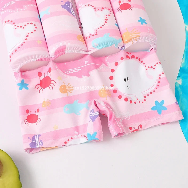 Kids buoyancy swimsuit by Baby Bubble featuring colorful cartoon float design, designed for safe swimming and water fun.