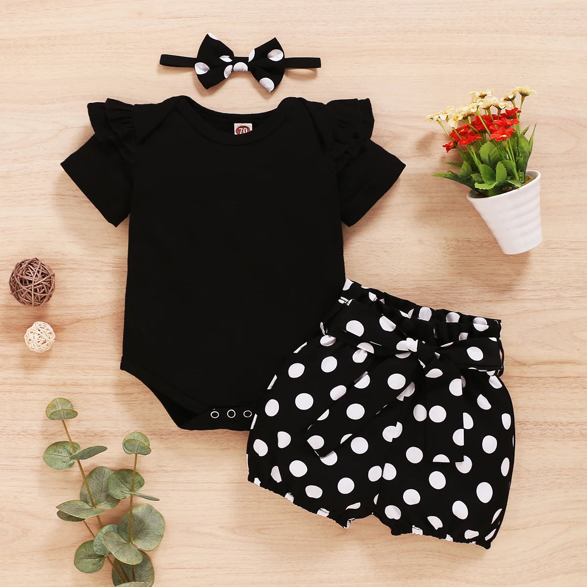 Baby Girl Summer Set by Baby Bubble, 3-piece outfit with colorful top, shorts, and sunhat, perfect for warm weather.