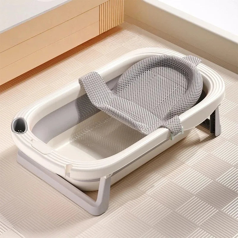Foldable Baby Bath Tub with temperature sensor from Baby Bubble, showing a compact design and built-in temperature display.