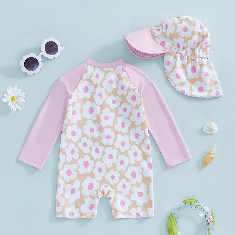 Baby girls rash guard set by Baby Bubble featuring floral and flamingo print, with long sleeves and colorful design.