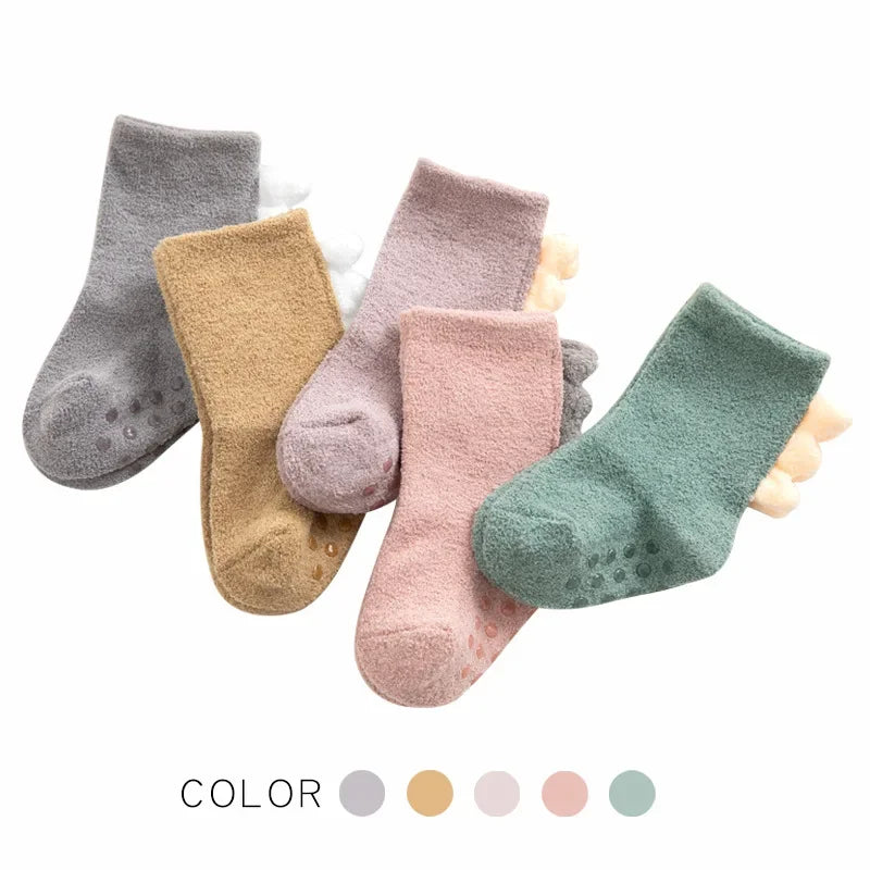 Baby Bubble baby dinosaur socks, soft and warm, featuring colorful dinosaur designs for little feet.