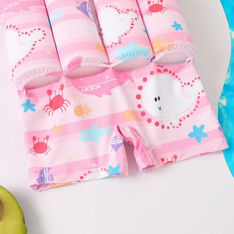 Kids buoyancy swimsuit with cartoon float design, safe swimwear by Baby Bubble, suitable for beginner swimmers and water fun.