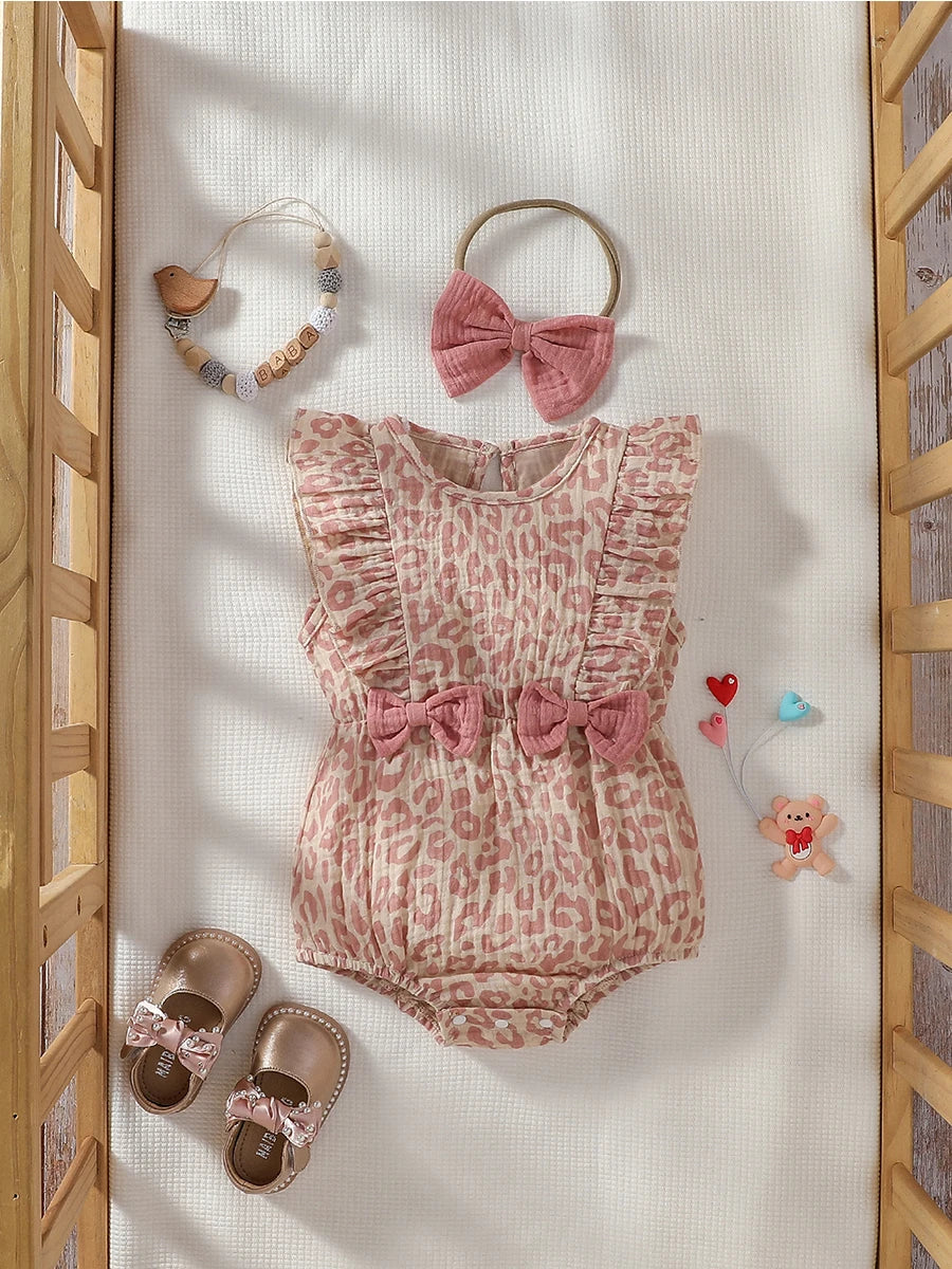 Baby Girl Summer Pink Jumpsuit by Baby Bubble with matching bow and headband, featuring a cute, sleeveless design for warm weather.