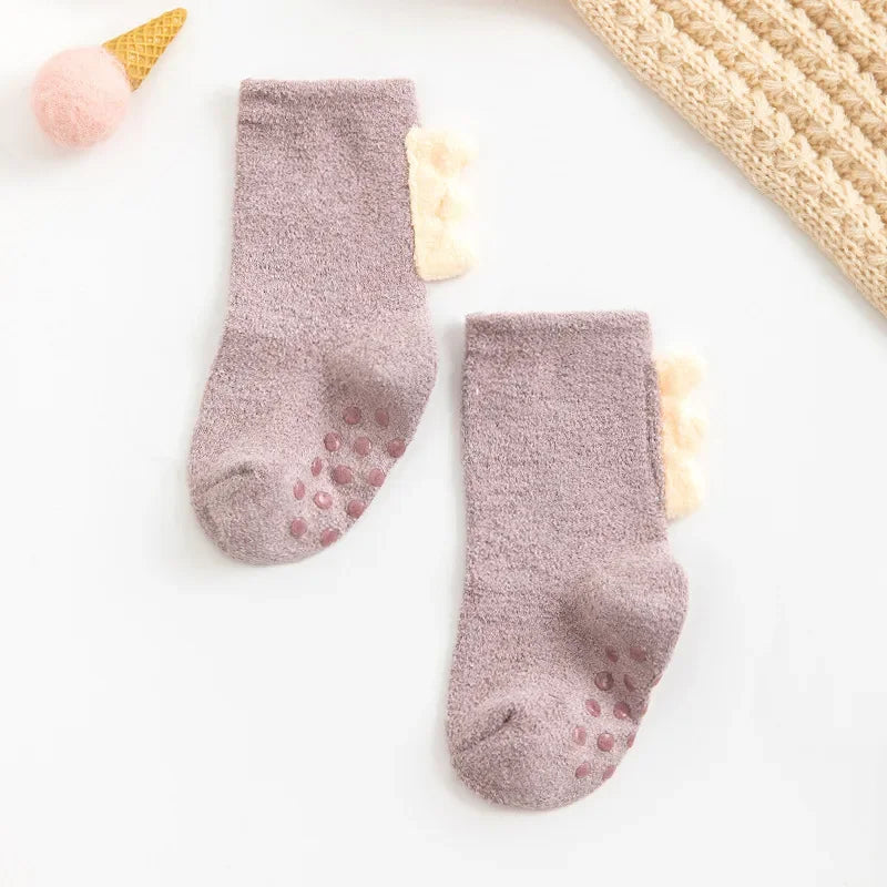 Baby Dinosaur Socks by Baby Bubble, soft and warm baby socks featuring colorful dinosaur designs, perfect for little feet.