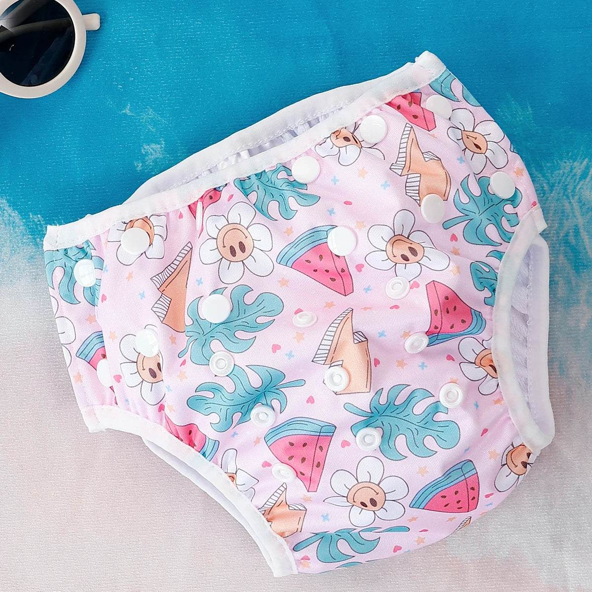 Baby Bubble reusable baby swim diapers with colorful animal print design, ideal for water play and swimming activities.