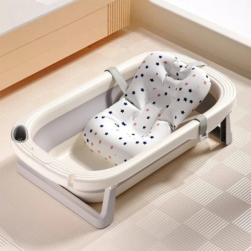 Baby Bubble foldable baby bath tub with built-in temperature sensor, shown collapsed and open for easy bathing.