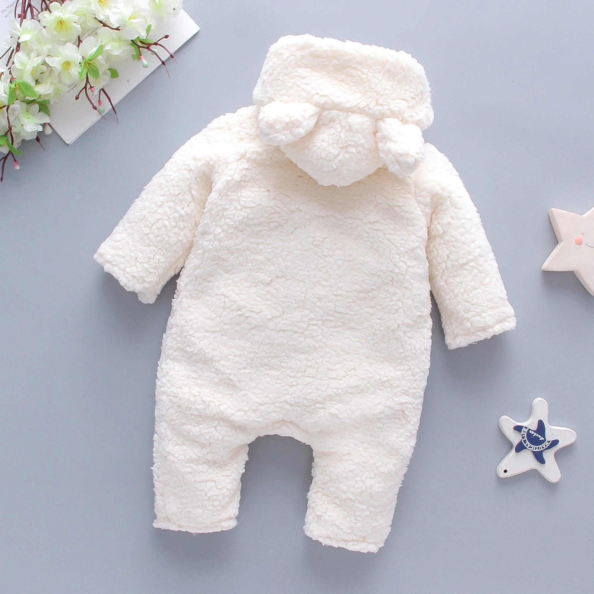 Soft fluffy lamb baby romper from Baby Bubble, warm winter jumpsuit with cozy fleece fabric and adorable lamb design.