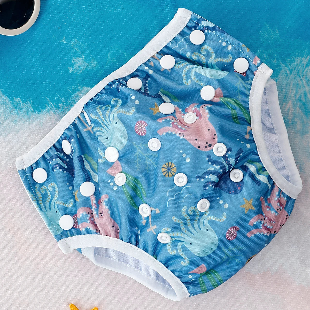 Reusable baby swim diapers with colorful animal print from Baby Bubble, designed for comfortable swimming and leak protection.