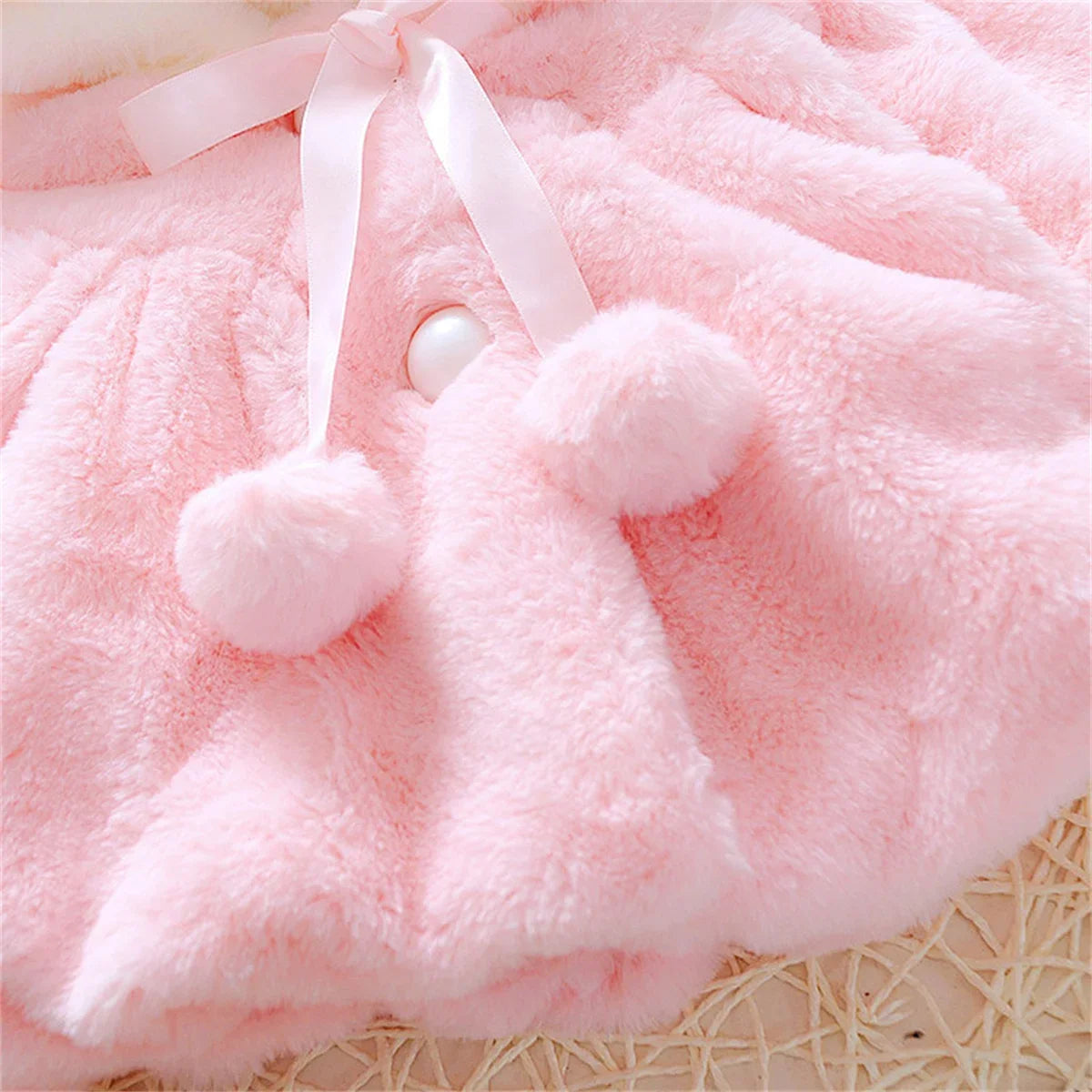 Girls wool cape by Baby Bubble featuring a cozy, stylish winter design with a soft, warm woolen fabric and classic cape silhouette.