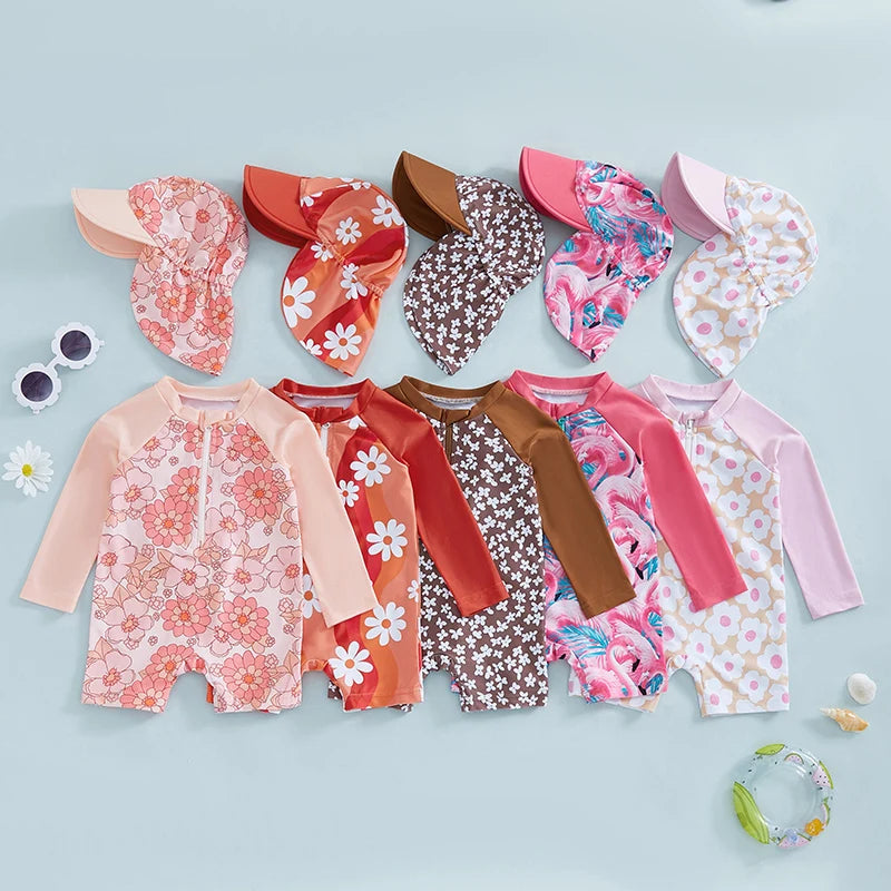 Baby girls' rash guard set by Baby Bubble with floral and flamingo print, featuring long sleeves and vibrant summer design.