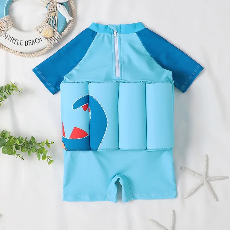 Kids buoyancy swimsuit by Baby Bubble featuring colorful cartoon float design and adjustable straps for safe swimming.