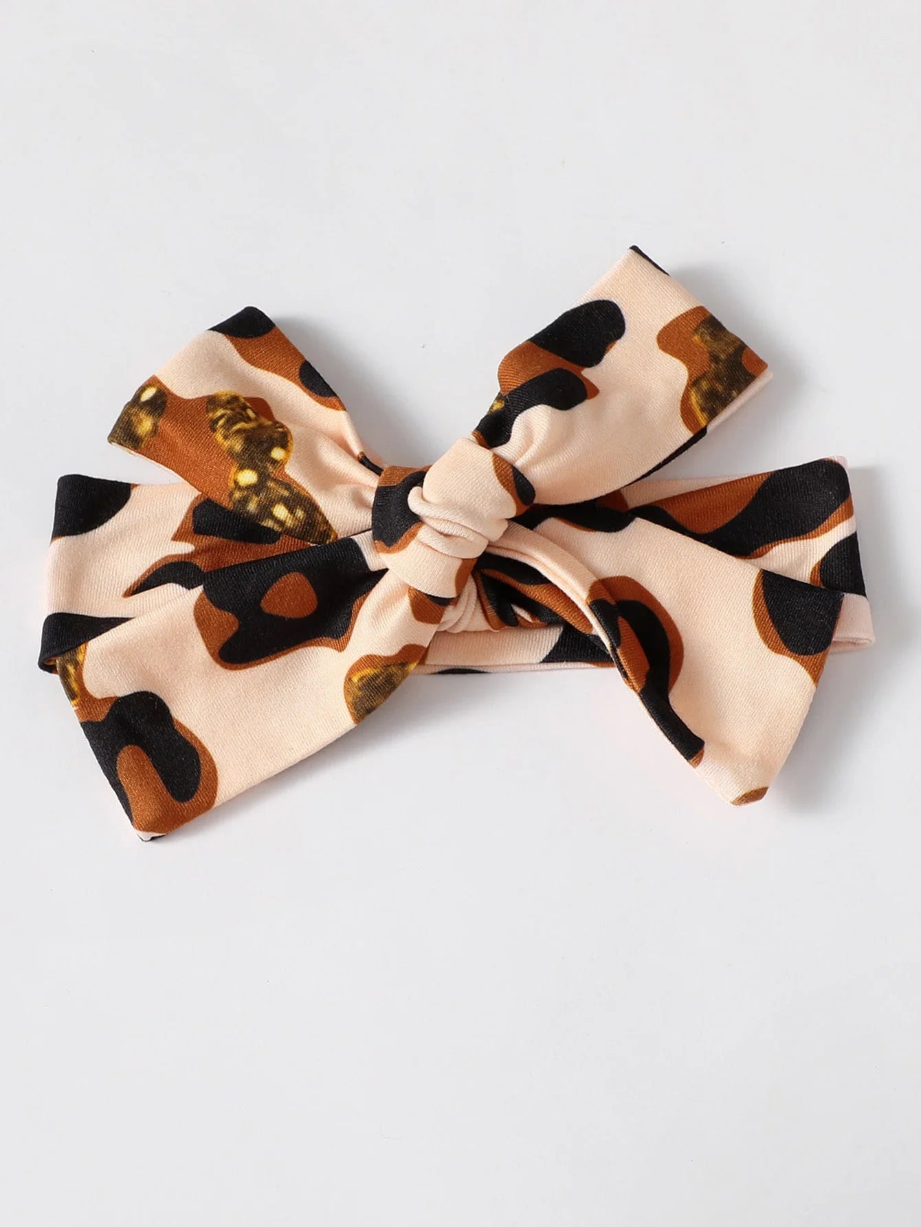 Baby Girl Leopard Jumpsuit Set by Baby Bubble featuring ruffle trim and matching headband, displayed on a soft background.