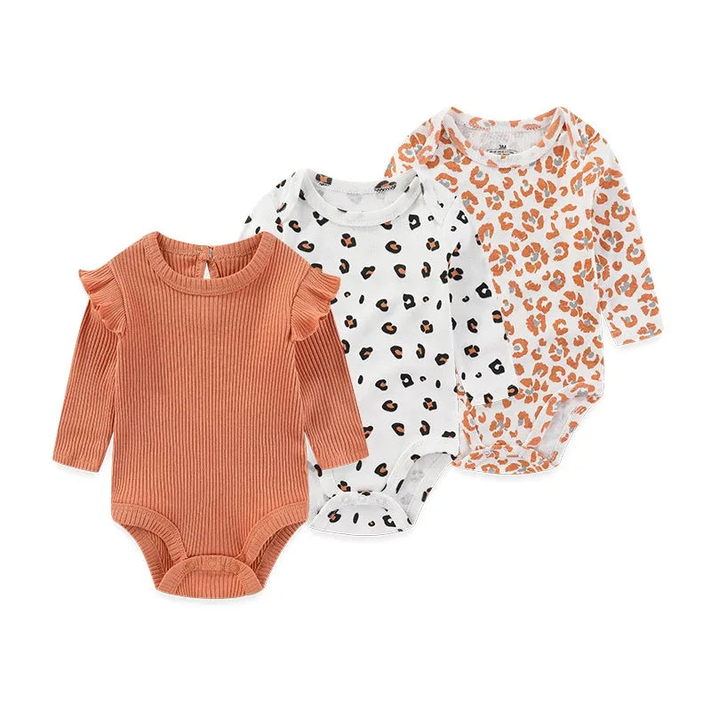 Set of three newborn cotton bodysuits from Baby Bubble, soft and comfortable everyday onesies for infants.