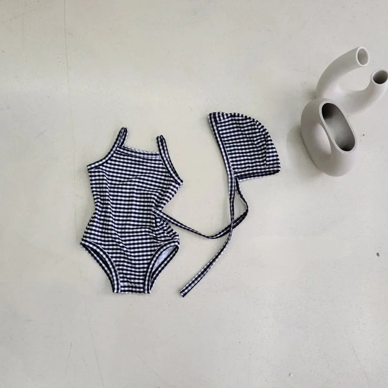 Baby Girl swimwear set with one-piece swimsuit and sun hat, Baby Bubble brand, featuring colorful floral pattern and sun protection design.