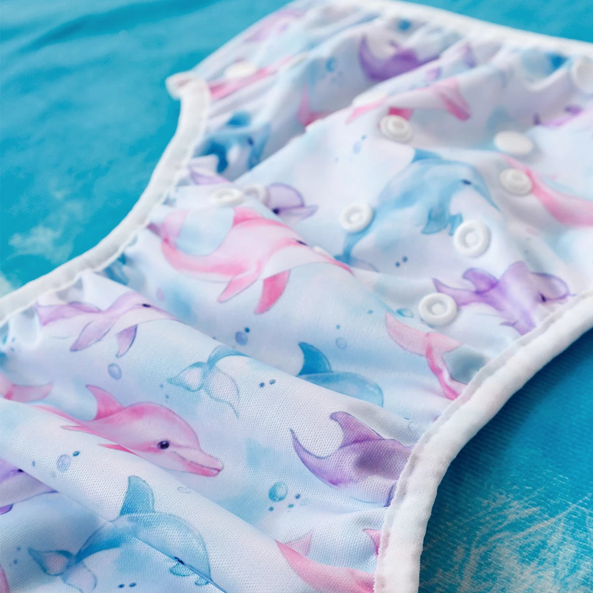 Baby Bubble washable baby swim diapers with adjustable fit, featuring colorful design and waterproof material for swimming.