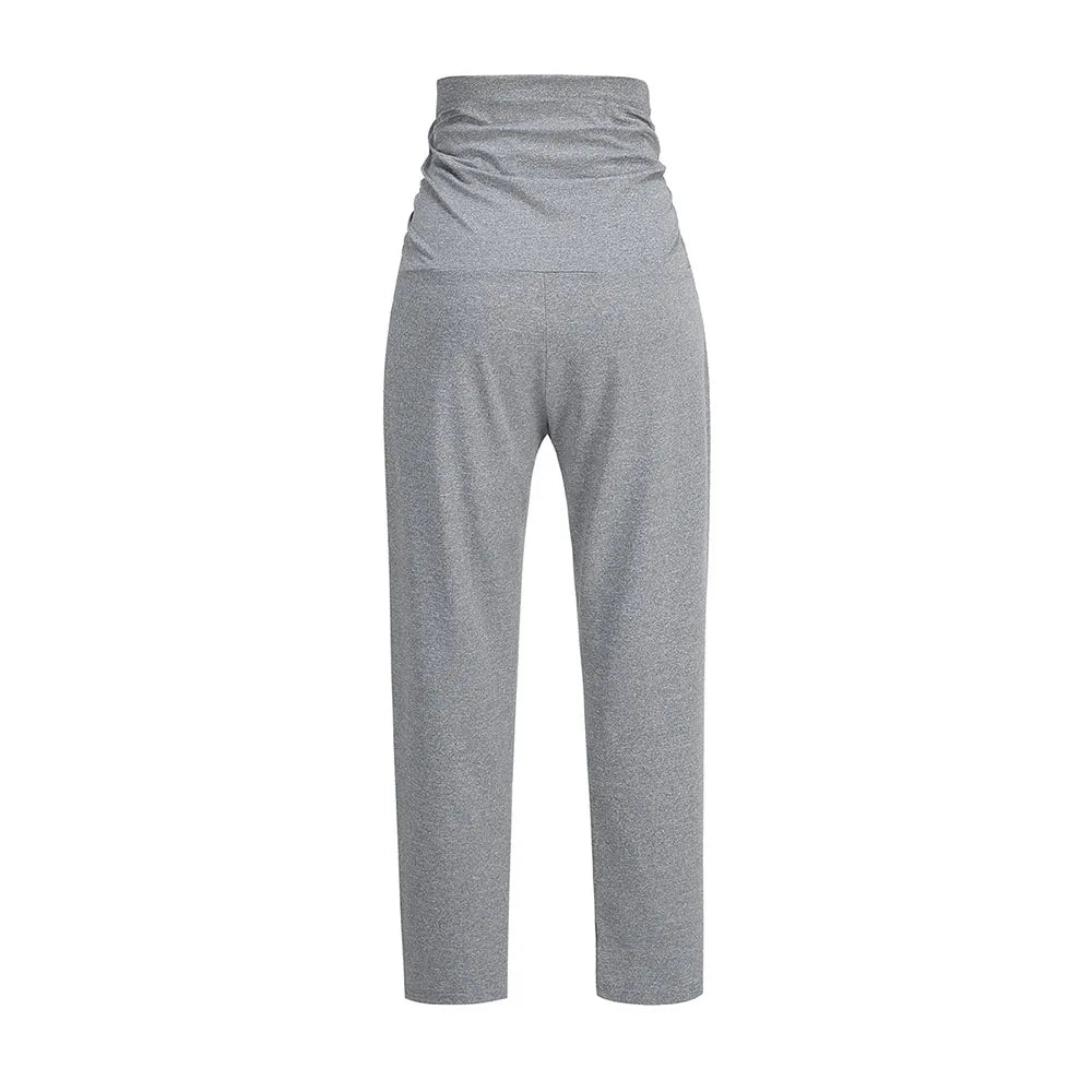Pregnant woman wearing Baby Bubble maternity wide-leg pants with over-belly comfort, showcasing stylish and relaxed fit.