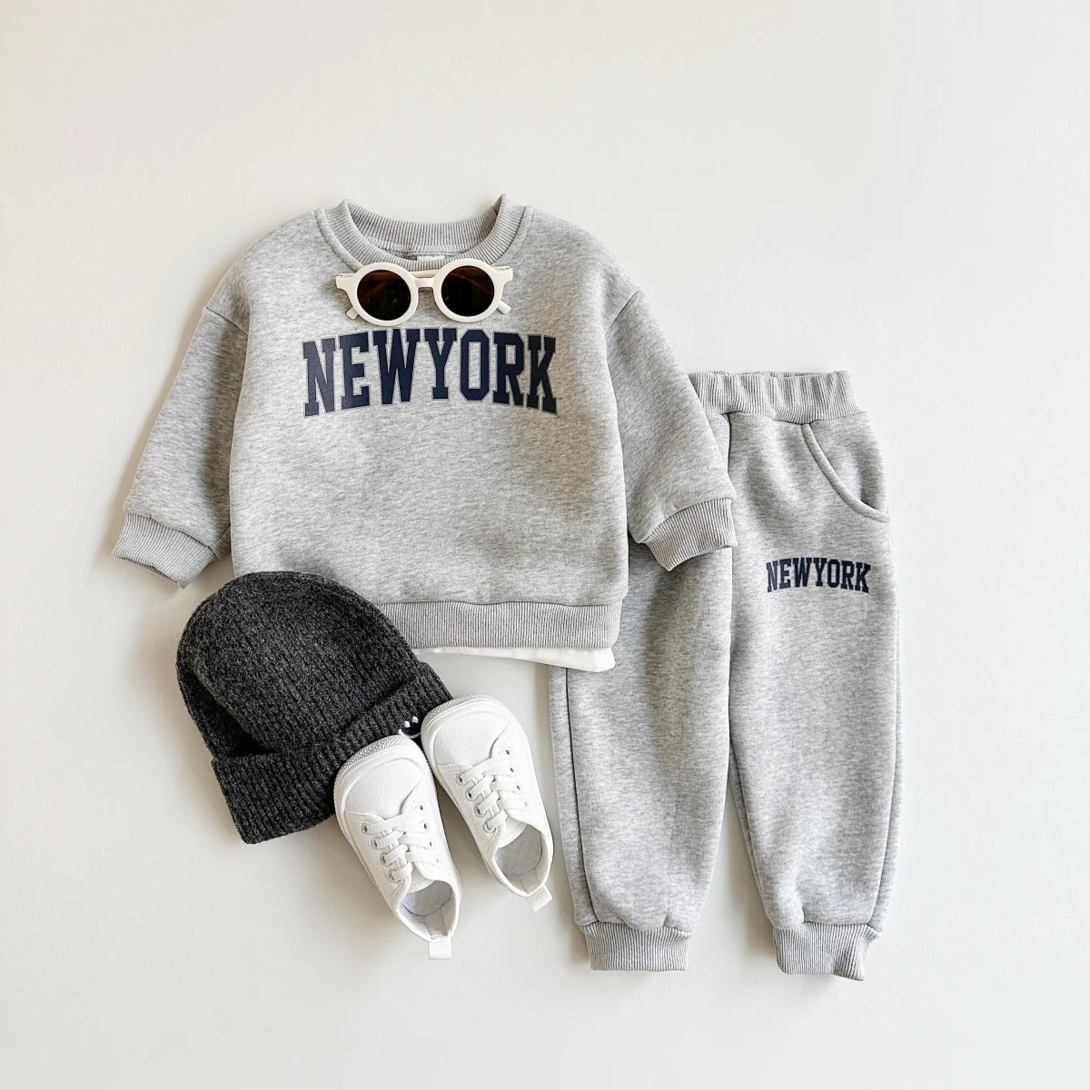 Baby Bubble newborn winter outfit with New York print top and matching pants, cozy and stylish for cold weather.