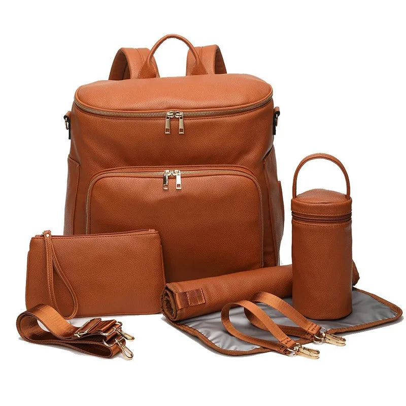 Baby Bubble PU leather diaper bag with multiple compartments and stylish design for travel and everyday use.