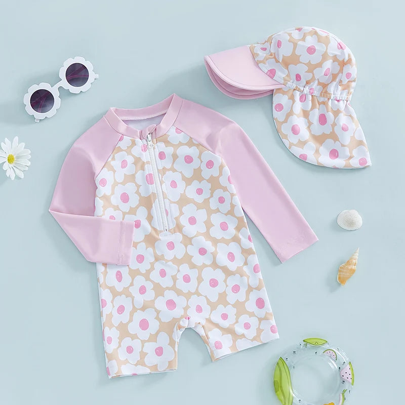 Baby Girl rash guard set by Baby Bubble featuring floral and flamingo print, with long sleeves and matching swim bottom.