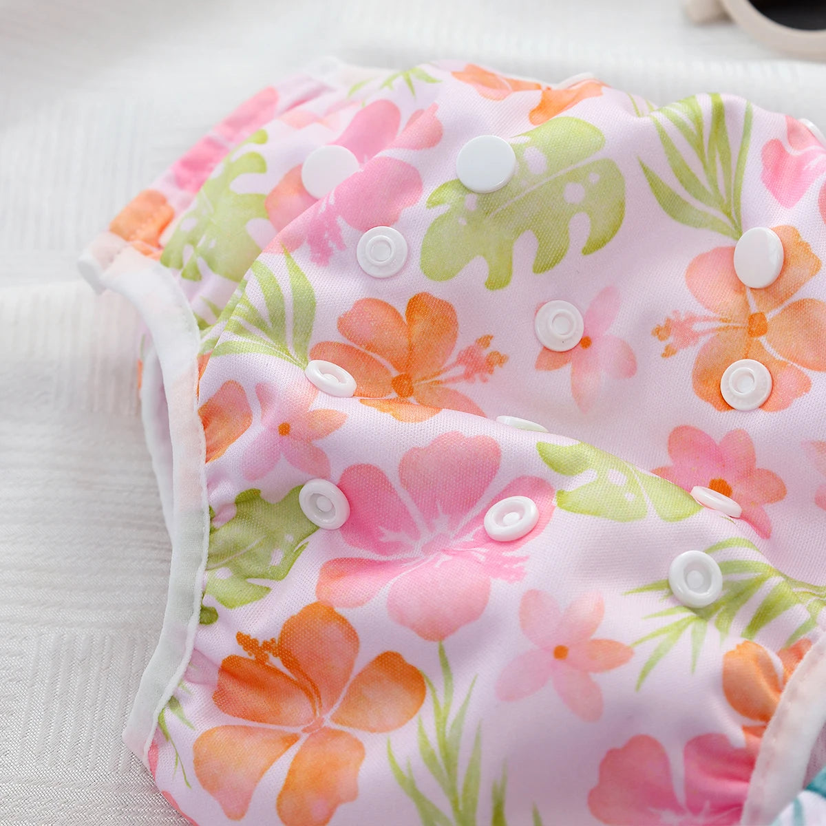 Baby Bubble washable baby swim diapers with adjustable fit, featuring colorful waterproof design for comfortable swimming.