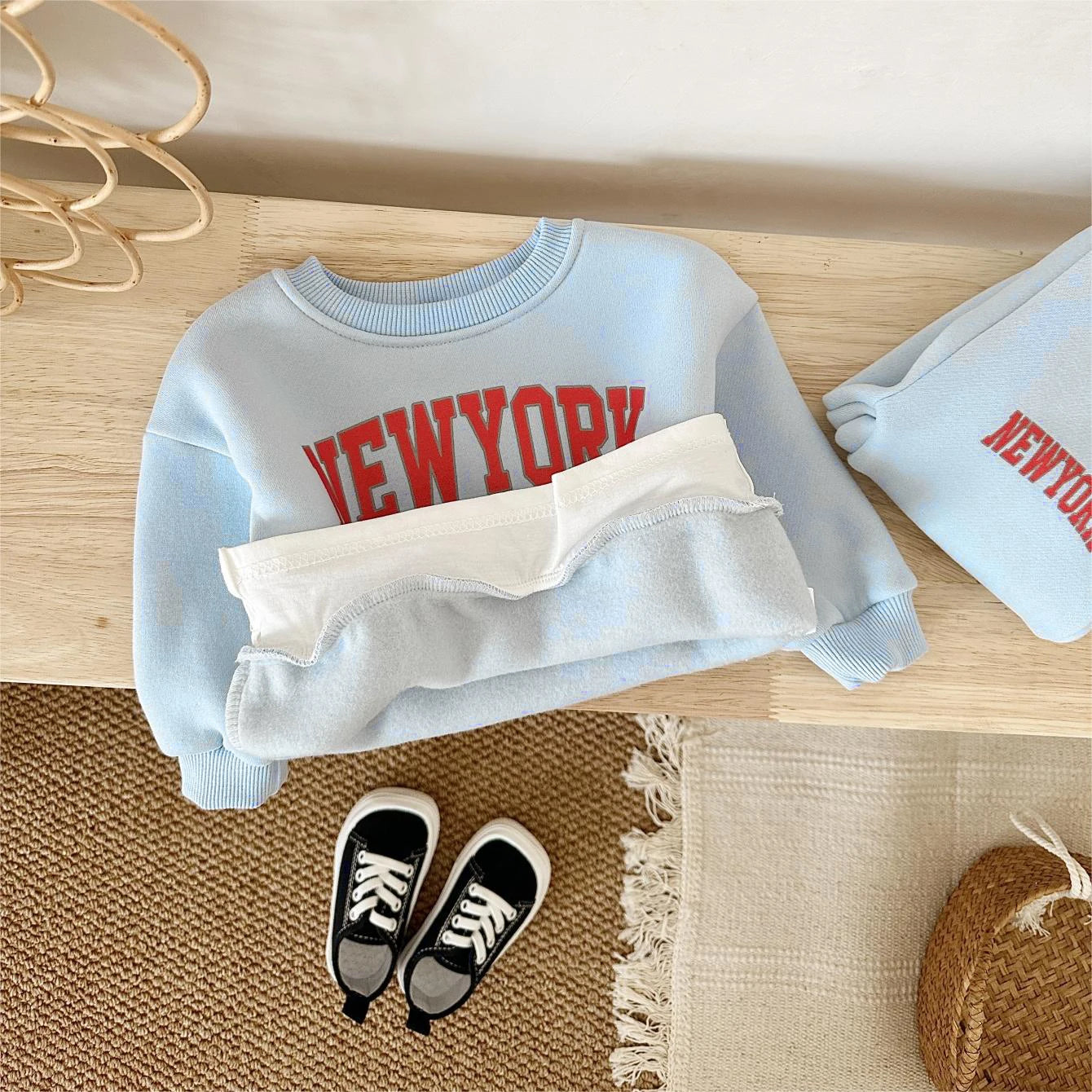 Baby Bubble baby winter outfit featuring a New York print top and pants in a cozy 2-piece set.