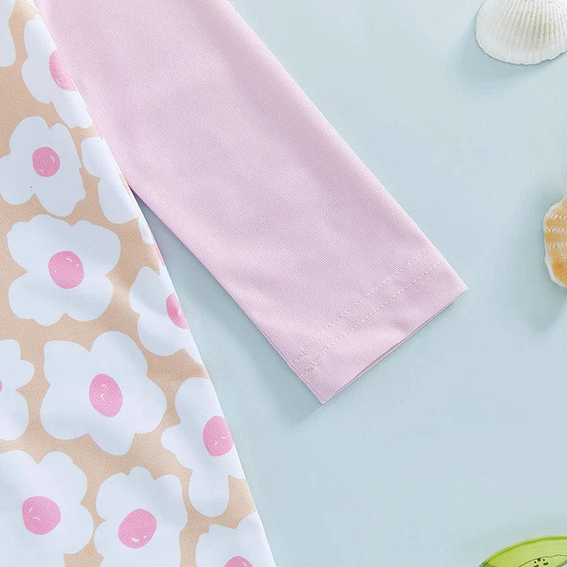 Baby girls rash guard set with floral and flamingo print from Baby Bubble, featuring a colorful, sun-protective swimwear design.