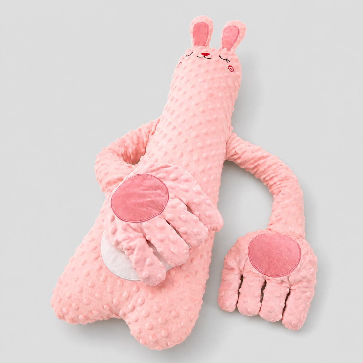 Baby patting pillow with remote control, soft pillow designed to soothe babies with gentle patting and calming sounds.