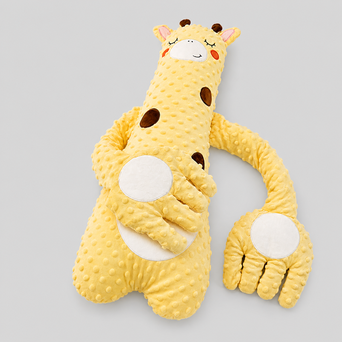 Baby patting pillow with remote control, soft fabric, and calming features for soothing infants.